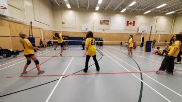 Students playing volleyball.