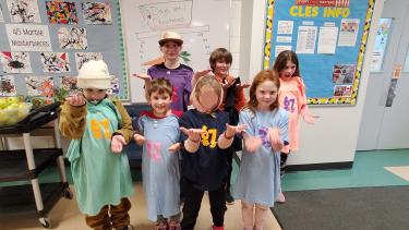 7 students wearing shirts that say "6, 7" on them