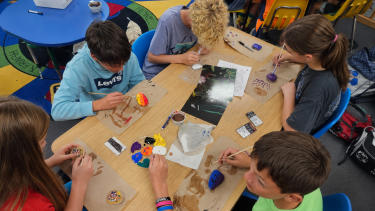 Students painting rocks