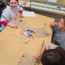 students painting rocks
