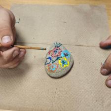students painting rocks