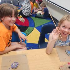 students painting rocks