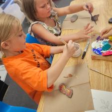 students painting rocks