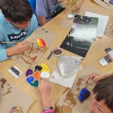 students painting rocks